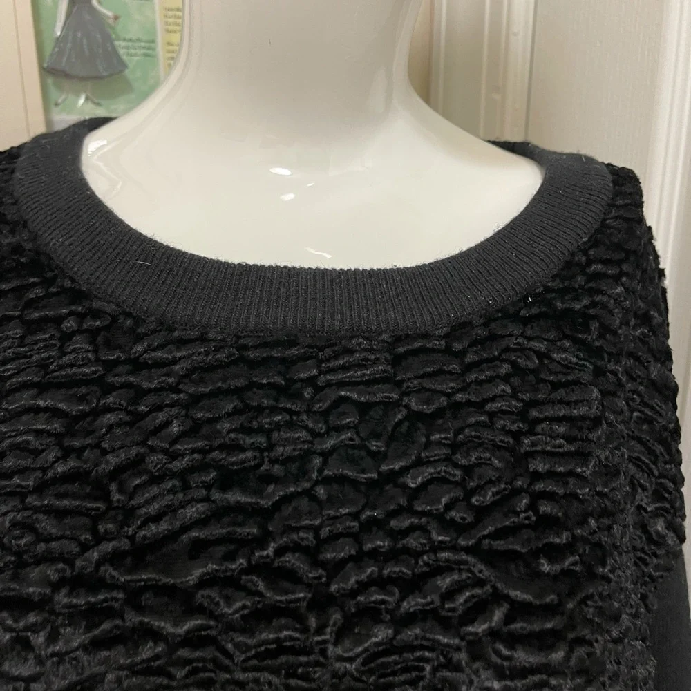 Kate spade black sweater. Looks like Front made with the unique sheep fur.
